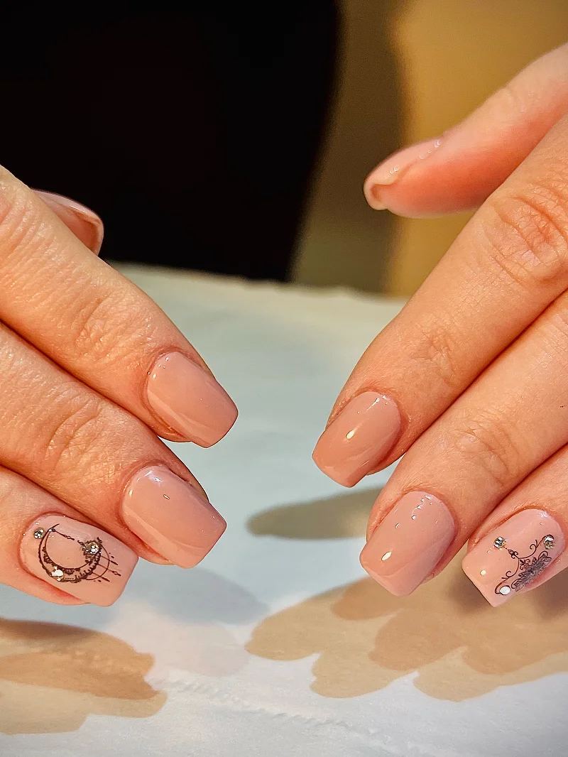 Nude nails with henna mandala accent