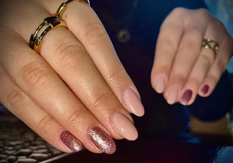 Nude nails with rose gold glitter accent