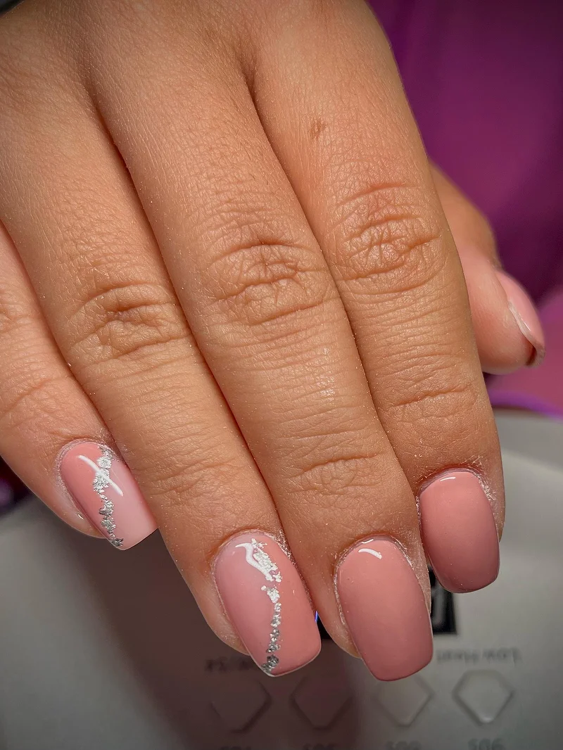 Pink and nude nails with silver wave detail