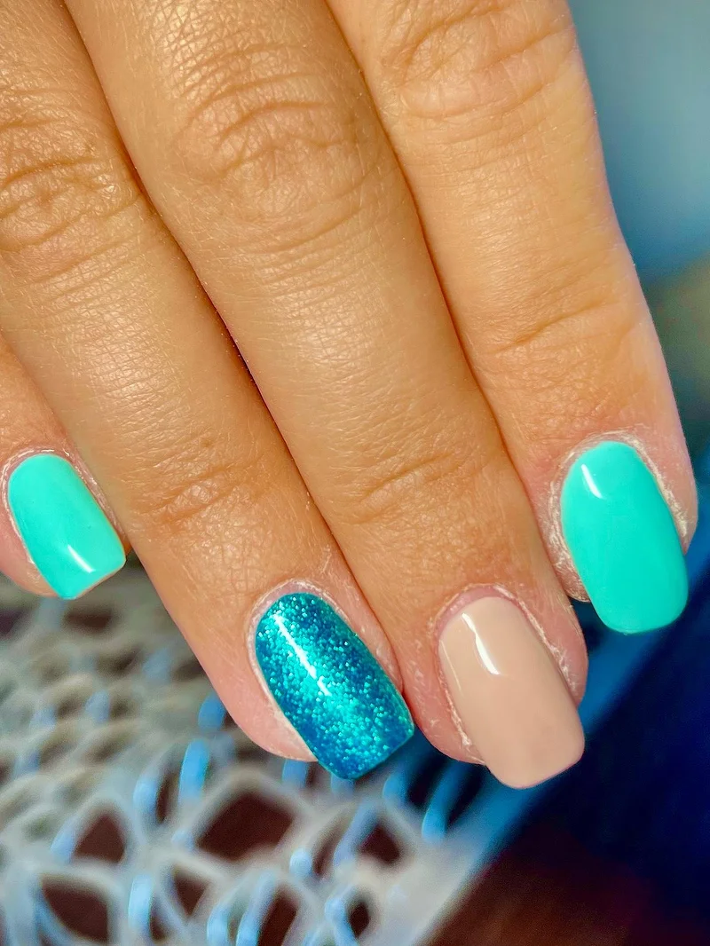 Teal turquoise glitter nails with nude accent